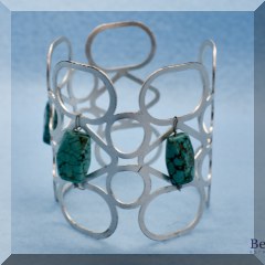 J15. Silvertone and turquoise cuff bracelet - $14